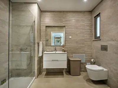 a bathroom with a tub and a sink and a shower at Villa Sónia Lote 69 - VIP Properties by Interhome in Albufeira