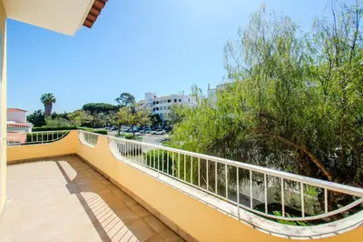 a bathroom with a toilet and a sink and a mirror at Villa Orange with private pool Albufeira in Albufeira