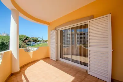 a living room with a couch and a fireplace at Villa Orange with private pool Albufeira in Albufeira