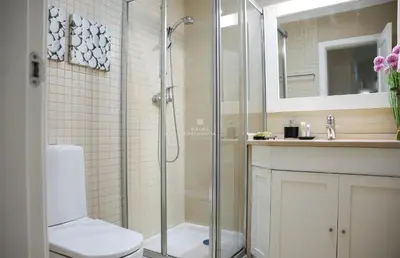 a bathroom with a shower and a toilet and a sink at Apartment - Vilamoura Pine By Dalma Portuguesa in Quarteira