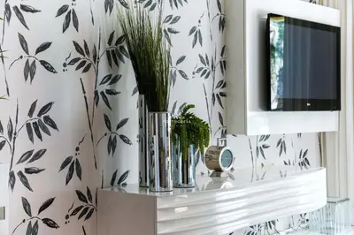 a living room with black and white wallpaper at Apartment - Vilamoura Pine By Dalma Portuguesa in Quarteira