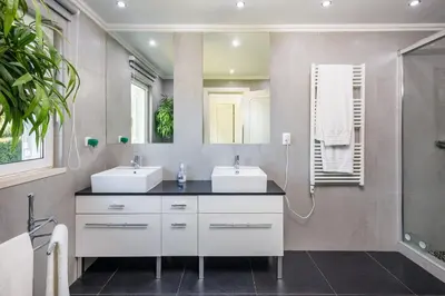 a bathroom with two sinks and a shower at Charming Vale Do Lobo Villa 4 Bedrooms Villa Quadradinhos 22 Private Pool in Almancil