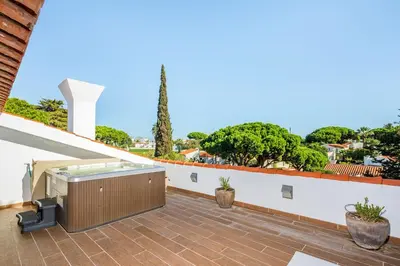a hot tub on the roof of a house at Charming Vale Do Lobo Villa 4 Bedrooms Villa Quadradinhos 22 Private Pool in Almancil