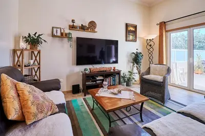 a living room with a couch and a coffee table at NEU - Casa Tina mit Meerblick und Pool in Guia