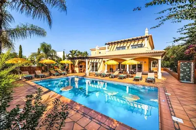 a large swimming pool in front of a house at Villa Cabrita de Parra in Galé