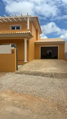 a large yellow house with a garage at Holiday HouseV5 W/Pool & BBQ in Albufeira