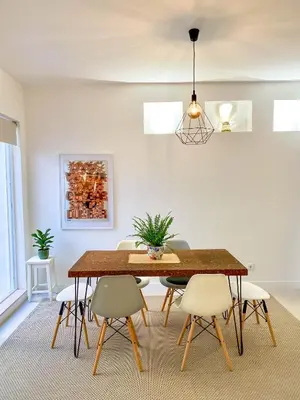 a dining room with a table and chairs at Casa Longa Faro - Traditional Portuguese House with modern comforts in Faro