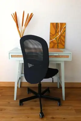 a black office chair sitting in front of a desk at Vilamoura Sunrise in Quarteira