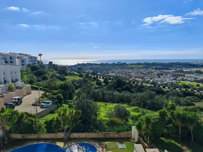 a view of a city from a building at Apartamento Páteo - piscina, churrasqueira e vista jardim in Albufeira
