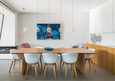 a dining room with a wooden table and white chairs at Villa Algarve Paradise in Vilamoura