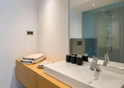 a bathroom with a white sink and a mirror at Villa Algarve Paradise in Vilamoura