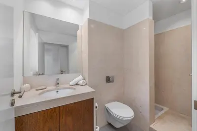 a bathroom with a sink and a toilet at Pine Garden Apartment Vilamoura in Vilamoura