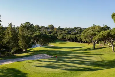 a view of a golf course with a green at Pine Garden Apartment Vilamoura in Vilamoura