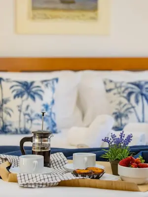 a bedroom with a large bed and a large window at Pine Haven in Faro