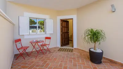 a living room with two couches and a fireplace at Pine Haven in Faro