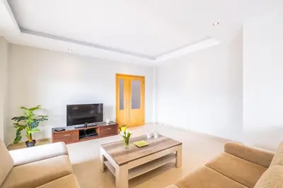 a living room with a couch and a coffee table at Villa Aica - BY BEDZY in Guia