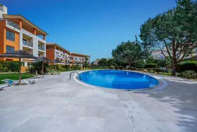 a swimming pool in the middle of a resort at Oleander Terrace Albufeira in Faro