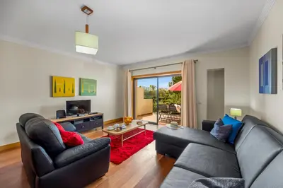 a living room with two couches and a television at Oleander Terrace Albufeira in Faro