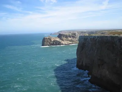 an aerial view of the ocean and a cliff at Sunny Haven Apartment Vilamoura in Vilamoura
