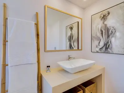 a bathroom with a sink and a mirror at AL - Vilamoura Top Floor in Vilamoura