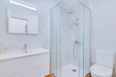 a bathroom with a shower and a toilet and a sink at AL - Vila Barreira, near the golf in Vilamoura