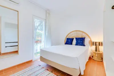 a bedroom with a bed and a window at AL - Vila Barreira, near the golf in Vilamoura