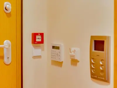 a wall with some electrical devices on a wall at AL - Apartamento Vila Sol Adaptado in Vilamoura