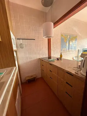 a kitchen with a sink and a counter top at Ouramar Apartment in Albufeira