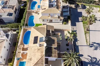 an aerial view of a building with palm trees at Villa Verde by IntiHolidays in Guia