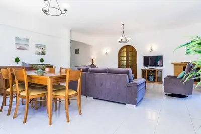 a living room with a table and a couch at Villa Bonita Gale in Galé