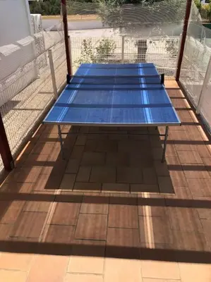 two blue tables sitting on top of a deck at Villa Martin in Albufeira