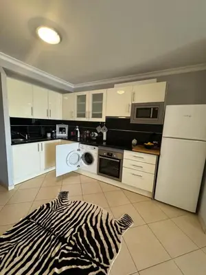 a kitchen with a zebra rug on the floor at Villa Martin in Albufeira