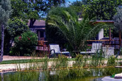 two chairs sitting next to a body of water at The Quinta Retreat Algarve Available to Facilitators yoga & sound therapies, massage mindfulness in Almancil