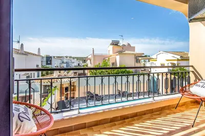 a balcony with chairs and a view of a city at Villa Timoneiro in Galé