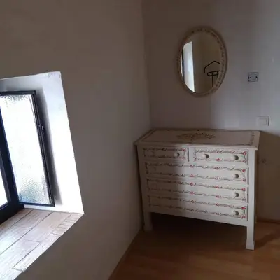 a bedroom with a dresser and a mirror at Bela Vista House - Quinta amoreira in Benafim