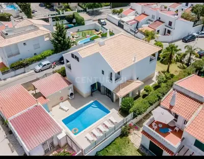 an aerial view of a house with a swimming pool at Villa Lucia, Olhos D'Agua, Albufeira in Albufeira