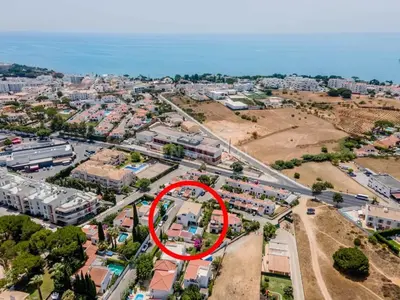 an aerial view of a city with a red circle at Villa Lucia, Olhos D'Agua, Albufeira in Albufeira