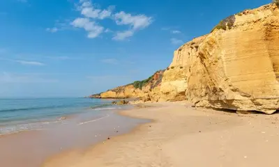 a city with buildings and the ocean in the background at Ocean Eyes. Amazing 180º view of the sea and city in Albufeira