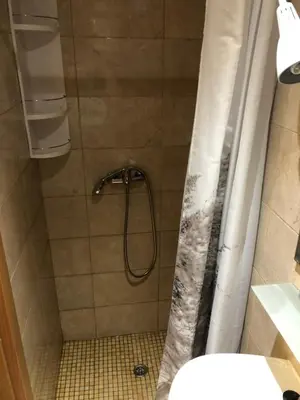 a shower with a shower curtain in a bathroom at Apartment near ocean Rua Alves Correia in Albufeira