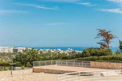 a view of a park with a city in the background at Apartamento albufeira cerro da águia in Albufeira