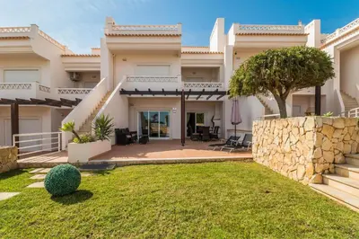 a view of a house with a yard at Apartamento albufeira cerro da águia in Albufeira