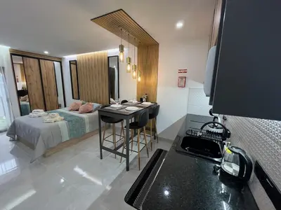 a bedroom with a bed and a desk in a room at Comfy Home in Albufeira