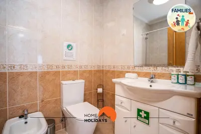 a bathroom with a toilet and a sink and a mirror at #201 Families Only - Quinta da Flor in Albufeira