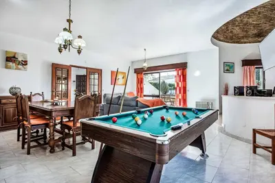 a living room with a pool table at Villa Gira in Albufeira