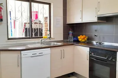 a kitchen with a sink and a window at Villa Mirasol - Relaxed Private Villa in Albufeira
