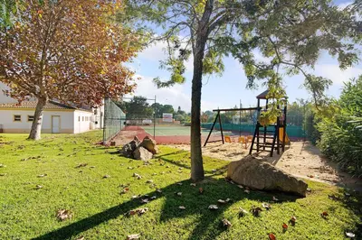 a park with a playground with a swing at Casa Estrela do Mar, 2 Quartos, Praia de São Rafael, Albufeira in Albufeira