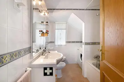 a white bathroom with a sink and a toilet at Casa Estrela do Mar, 2 Quartos, Praia de São Rafael, Albufeira in Albufeira