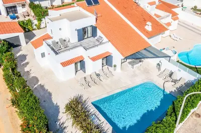 an aerial view of a house with a swimming pool at Villa Catarino in Albufeira