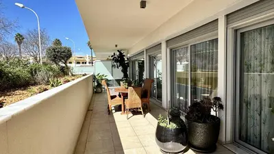 an outdoor patio with a table and chairs on a balcony at Harmony by Check-in Portugal in Albufeira