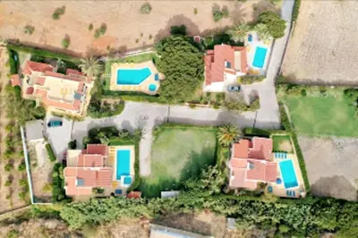 an aerial view of a house with blue roofs at Villa Palmeiras - Serene Private Villa in Albufeira